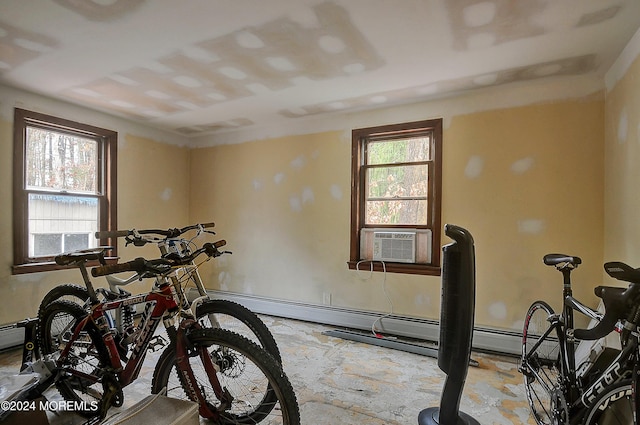 workout area featuring plenty of natural light and cooling unit