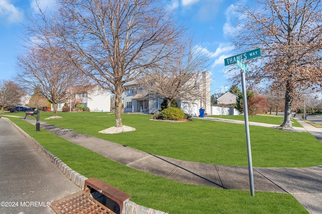 surrounding community with a yard