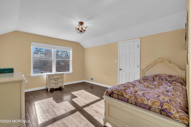 bedroom featuring vaulted ceiling and dark hardwood / wood-style floors