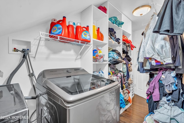 washroom featuring washing machine and dryer and hardwood / wood-style floors