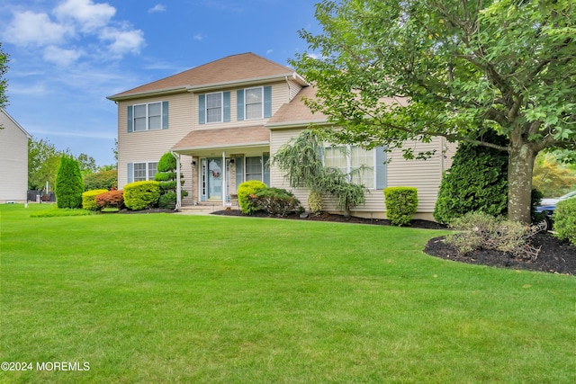 view of front of home with a front yard