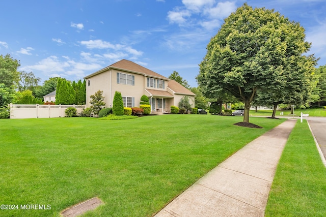 view of front of home featuring a front lawn