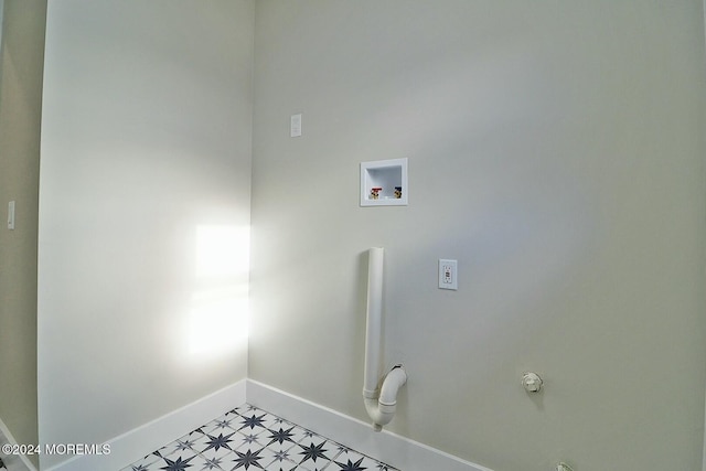 clothes washing area featuring hookup for a washing machine and gas dryer hookup