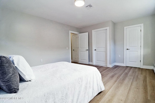 bedroom featuring light hardwood / wood-style flooring