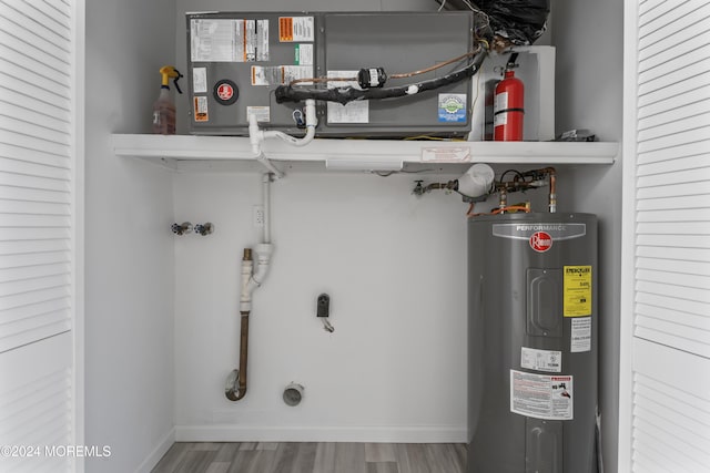 utility room with electric water heater