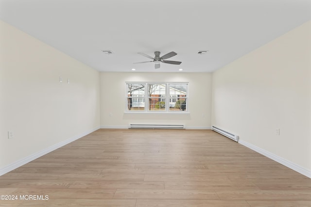 unfurnished room featuring ceiling fan, light wood-type flooring, and a baseboard radiator