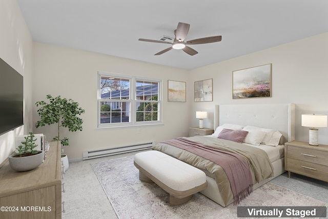 bedroom featuring ceiling fan, light colored carpet, and a baseboard heating unit