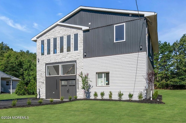 rear view of house with a lawn