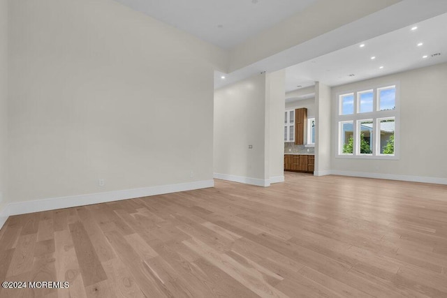 unfurnished living room featuring light hardwood / wood-style flooring