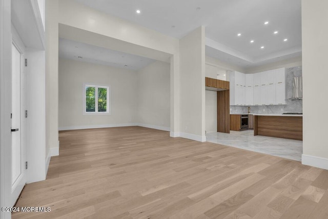 unfurnished living room featuring light hardwood / wood-style floors