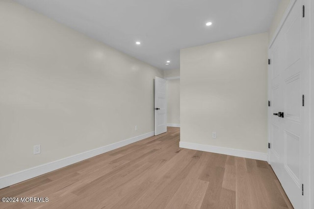 spare room with light hardwood / wood-style flooring