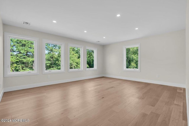 spare room featuring light wood-type flooring