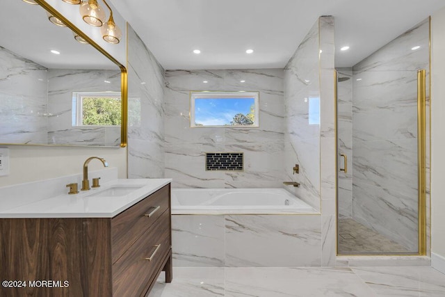 bathroom featuring shower with separate bathtub and vanity