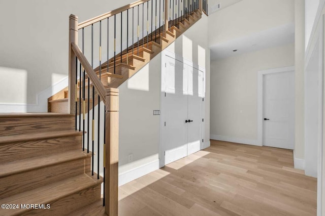 stairway featuring wood-type flooring