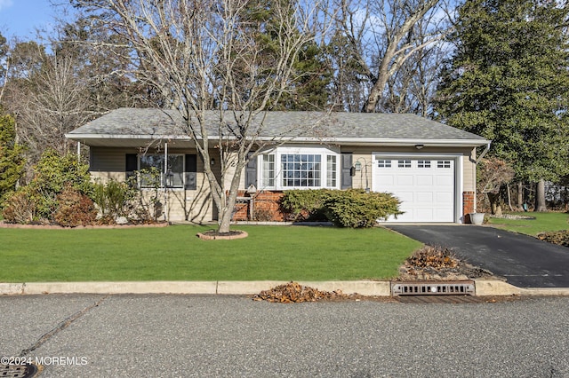 ranch-style house with a front lawn and a garage