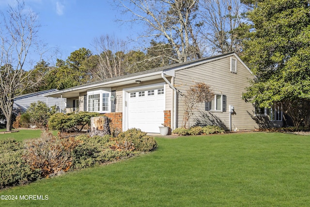 view of property exterior featuring a lawn and a garage