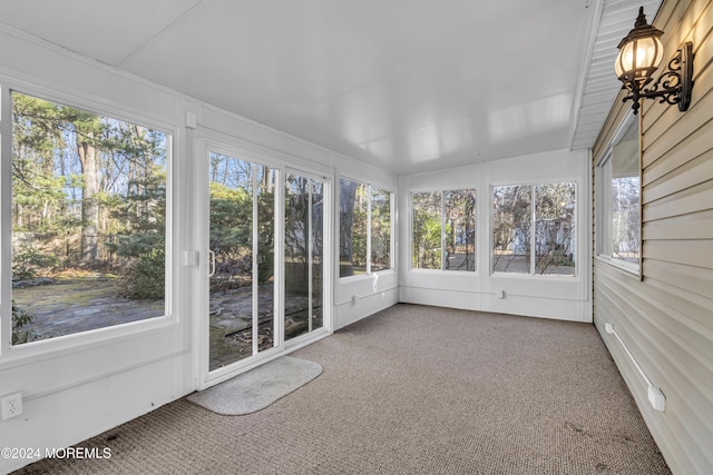 unfurnished sunroom with plenty of natural light and lofted ceiling