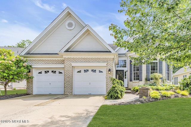 7 Muirfield Rd, Jackson, NJ 08527 - view of front of home with driveway, brick siding, an attached garage, and a front yard