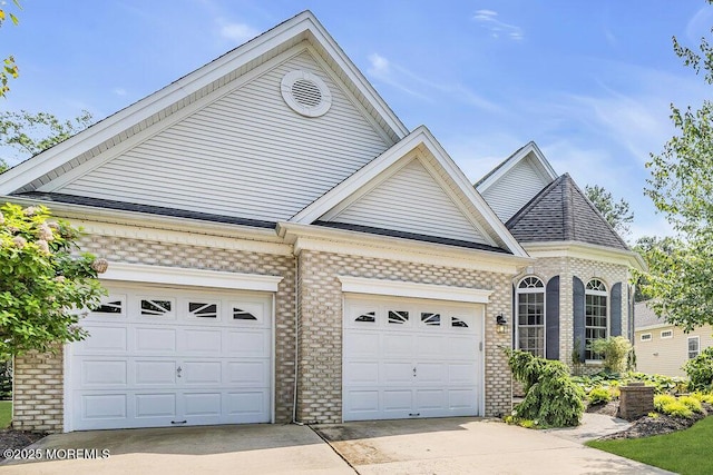 7 Muirfield Rd, Jackson, NJ 08527 - view of front facade featuring concrete driveway, brick siding, and a garage