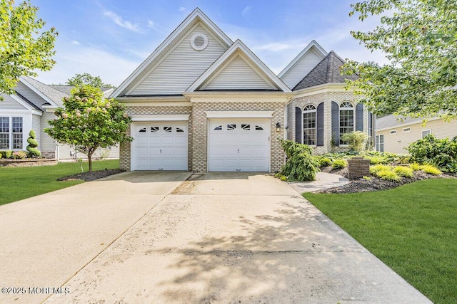 7 Muirfield Rd, Jackson, NJ 08527 - view of front facade featuring brick siding, concrete driveway, a front lawn, and a garage