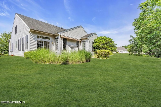 7 Muirfield Rd, Jackson, NJ 08527 - view of side of property with a lawn and roof with shingles