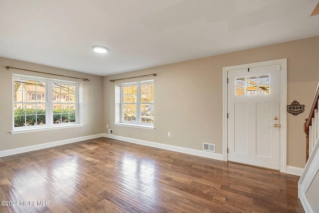 foyer entrance with dark wood-type flooring