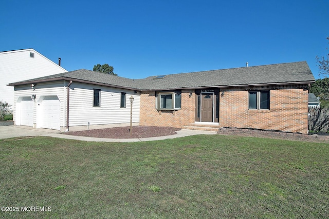 ranch-style house featuring a garage, brick siding, driveway, and a front lawn