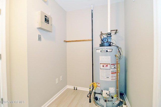 utility room featuring gas water heater