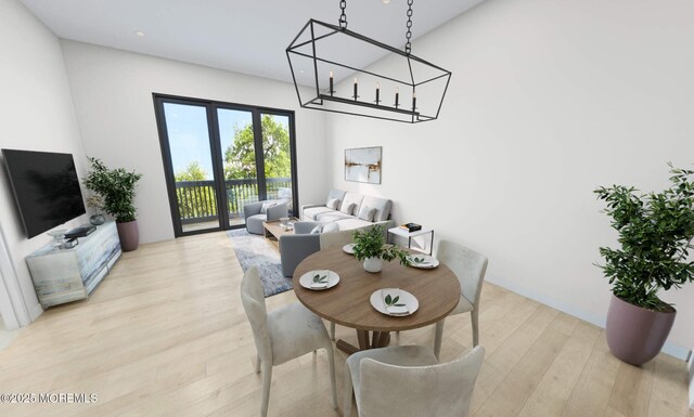 dining area with light wood-type flooring and french doors