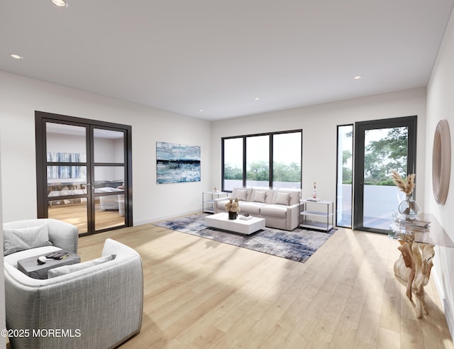 living room featuring light wood-type flooring and a healthy amount of sunlight