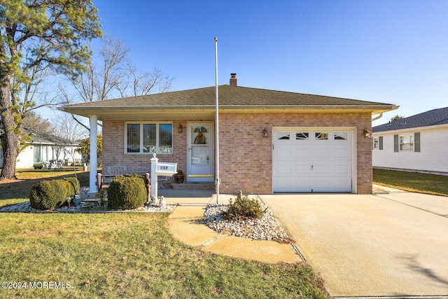 single story home featuring a front yard and a garage