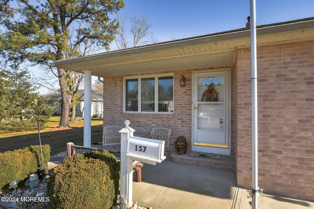 entrance to property featuring a porch