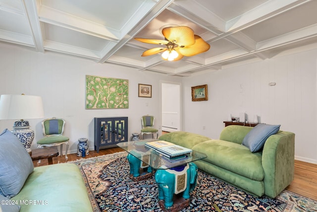 living room with hardwood / wood-style floors, coffered ceiling, and beam ceiling