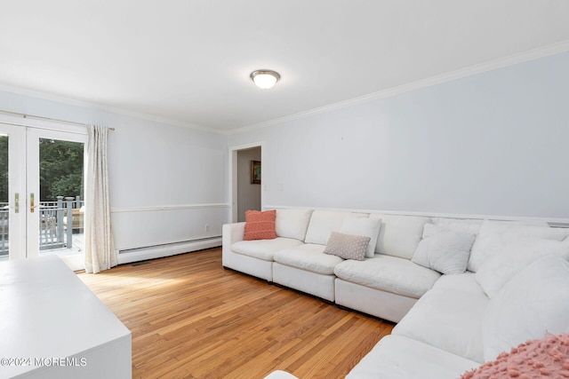 living room featuring hardwood / wood-style floors, french doors, ornamental molding, and a baseboard heating unit