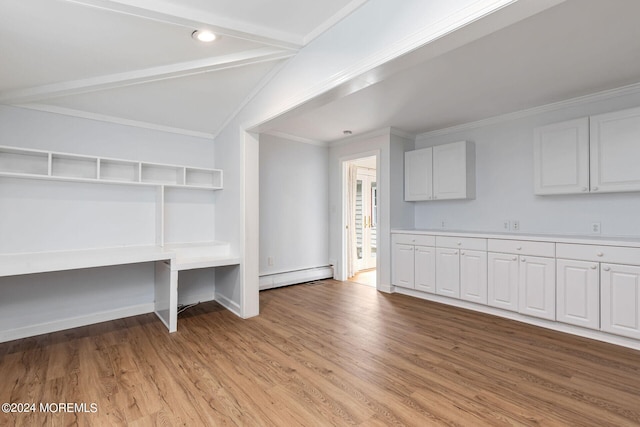 interior space with lofted ceiling, light wood-type flooring, baseboard heating, and crown molding