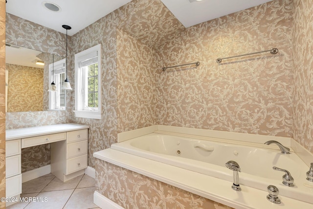 bathroom with tile patterned flooring and a tub