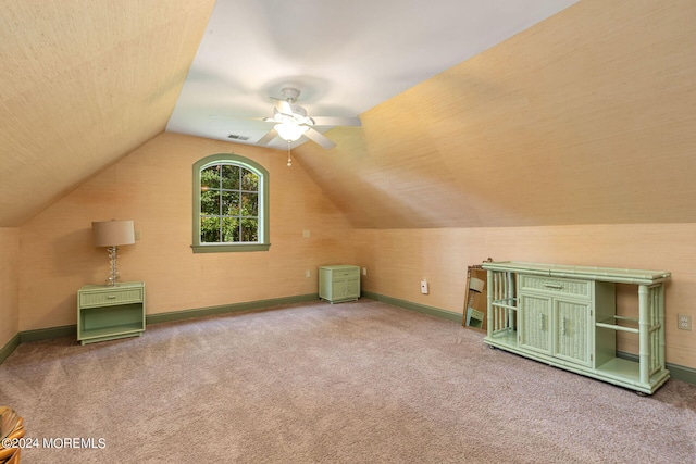 bonus room featuring ceiling fan, carpet floors, and vaulted ceiling