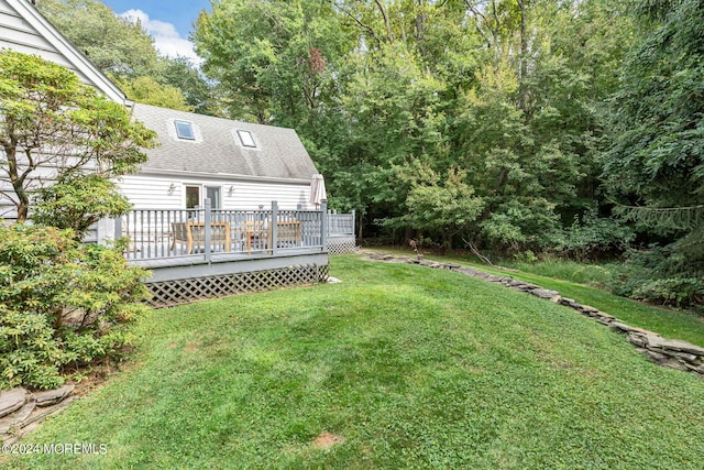 view of yard featuring a wooden deck