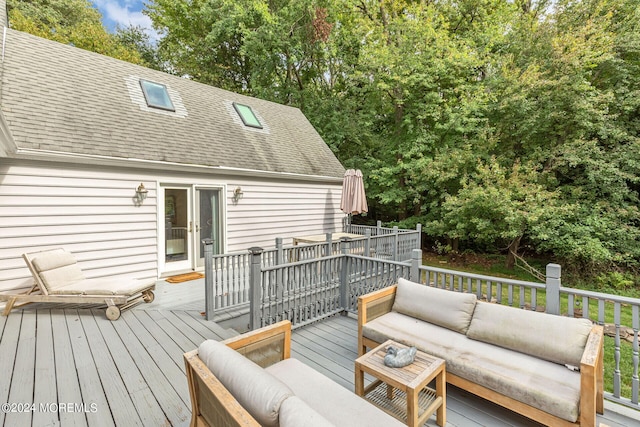 wooden deck featuring an outdoor hangout area