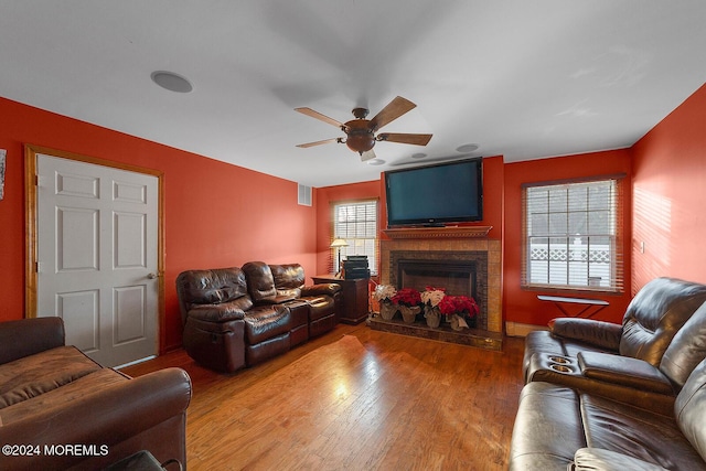 living room with ceiling fan and wood-type flooring