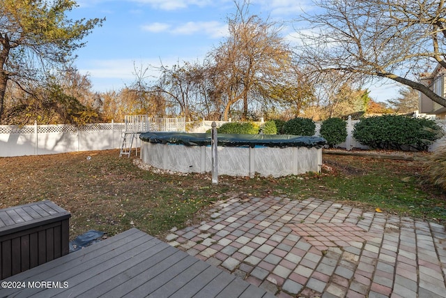 view of yard with a covered pool