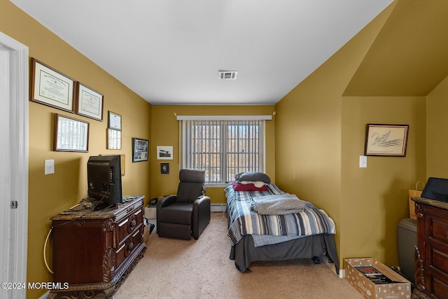 carpeted bedroom with baseboard heating