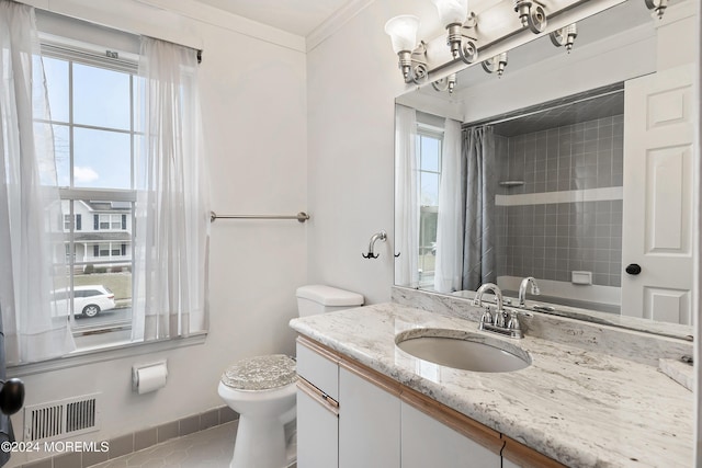 bathroom with vanity, a healthy amount of sunlight, toilet, and ornamental molding