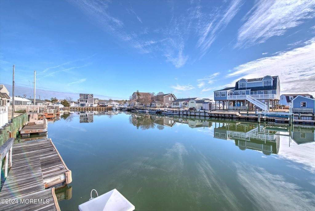 dock area with a water view