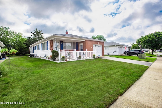 ranch-style home with central AC unit, a garage, a porch, and a front yard