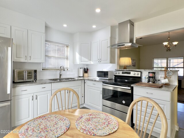 kitchen with ventilation hood, white cabinets, sink, appliances with stainless steel finishes, and light stone counters