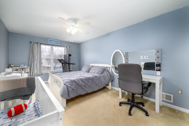 carpeted bedroom with ceiling fan