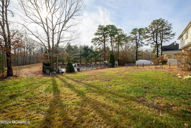 view of yard featuring a wooden deck