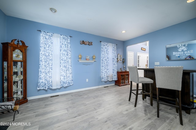 home office with light hardwood / wood-style floors