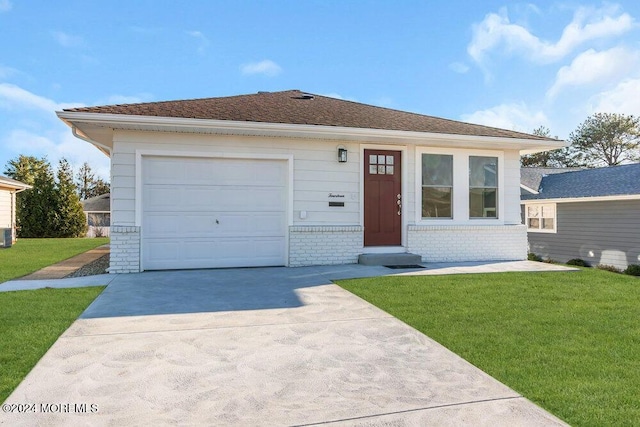 ranch-style house featuring a garage and a front lawn